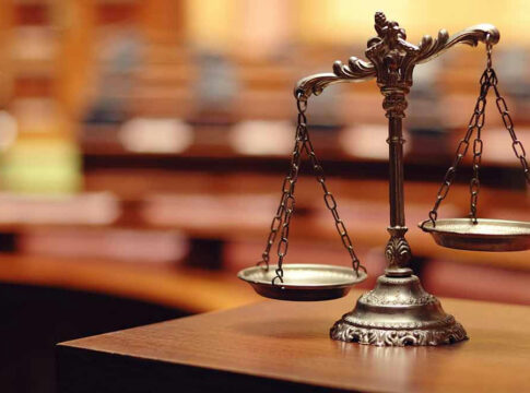 Bronze balance scale in courtroom.