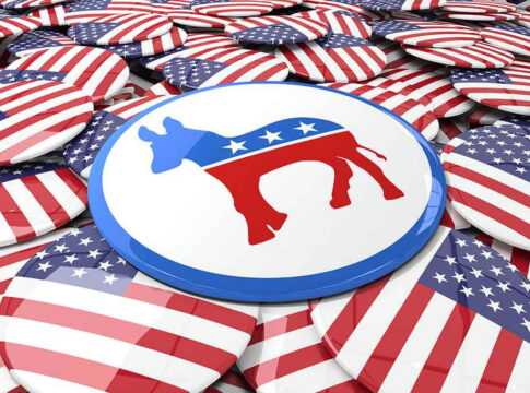 Democratic donkey symbol button among American flag buttons.