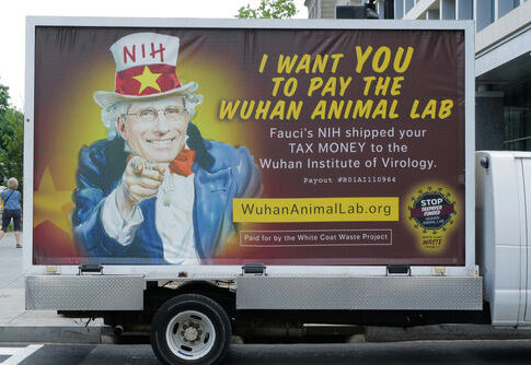 Truck billboard showing a message criticizing Anthony Fauci.